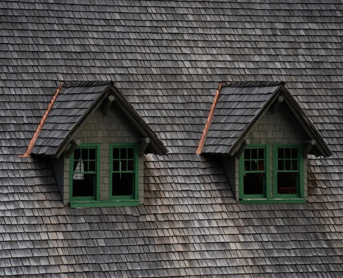 Dormers on a shingle roof in Duluth, MN, where step flashing and kickout flashing carry water past the walls