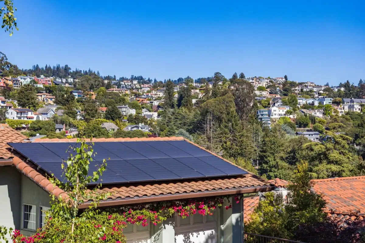 Neighborhood of roofs in Duluth, MN after a storm, where every household is running the same claim process