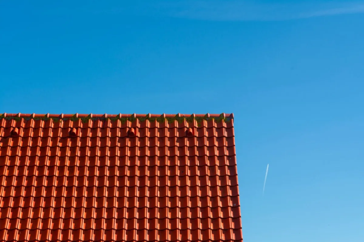 Tile roof gable in full sun, the kind of exposure that sets roof life in Duluth, MN